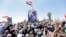 SYRIA QUNEITRA CONFLICT --  Hundreds of Syrians celebrate the flag-hoisting ceremony at al-Tahrir Square in the liberated city of Quneitra, southern Syria, 27 July 2018. 