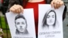 LATVIA - A woman holds a portrait of opposition journalist Roman Protasevich and his girlfriend Sofia Sapega during a protest of solidarity with Roman Protasevic at the Belarusian embassy in Riga, Latvia, 25 May 2021