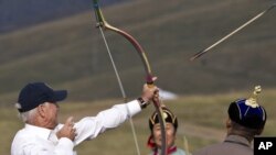 U.S. Vice President Joe Biden tries his hand at archery during a visit to the Mongolian capital, Ulan Bator.