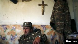 Nagorno-Karabakh -- An Armenian soldier takes a rest at an artillery position near the Nagorno-Karabakh's town of Martuni, April 7, 2016