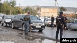 Security forces attend the scene of a bomb attack at a police station in Chechnya on September 16 that killed three people. 