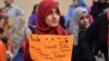 Pakistani students of the private PakTurk International Schools and Colleges demonstrate in Islamabad against the closing of their schools on November 17.