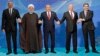 (Left to right:) Azerbaijani President Ilham Aliyev, Iranian President Hassan Rohani, Kazakh President Nursultan Nazarbaev, Russian President Vladimir Putin, and Turkmen President Gurbanguly Berdymukhammedov pose after the signing ceremony for a new convention on the status of the Caspian Sea on August 12. 