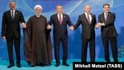 (Left to right:) Azerbaijani President Ilham Aliyev, Iranian President Hassan Rohani, Kazakh President Nursultan Nazarbaev, Russian President Vladimir Putin, and Turkmen President Gurbanguly Berdymukhammedov pose after the signing ceremony for a new convention on the status of the Caspian Sea on August 12. 