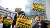 BOSNIA-HERZEGOVINA -- People display signs during a protest urging the government to obtain coronavirus disease (COVID-19) vaccines, in Sarajevo, April 6, 2021