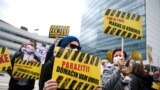 BOSNIA-HERZEGOVINA -- People display signs during a protest urging the government to obtain coronavirus disease (COVID-19) vaccines, in Sarajevo, April 6, 2021