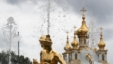 RUSSIA -- ST PETERSBURG, RUSSIA - JULY 2, 2020: Fountains and the Chapel of the Grand Palace in the Peterhof State Museum Reserve. The museum complex, which includes palaces and parks by the Gulf of Finland, is to partially reopen after being closed for m