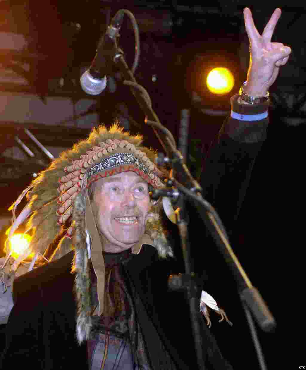 Havel, who was an ardent fan of rock music, greets the crowd at an open-air festival in the Bohemian town of Trutnov in 2007. The festival was dedicated to &quot;Chief Havel,&quot; hence the headdress. (Alexandra Mlejnkova)