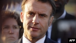 French President Emmanuel Macron speaks to the press upon his arrival at Cayenne-Felix Eboue airport in Cayenne, as part of a two-day visit to the French overseas department of Guiana, on March 25, 2024. (Photo by Ludovic MARIN / AFP)
