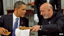 U.S. President Barack Obama (left) invited his Afghan counterpart, Hamid Karzai, to a Chicago NATO summit in May where the alliance is to define the next transition phase.