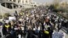 Pro-government demonstrators march in support of the regime after the weekly Friday Prayers in Tehran on January 5.