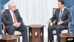 Syrian President Bashar Assad meets with Russian Deputy Foreign Minister Sergei Ryabkov in Damascus on September 17.