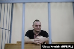 Belarus — JournDzmitry Halko came to the courtroom wearing a black short-sleeve shirt adorned with traditional Belarusian-Ukrainian embroidery patterns.