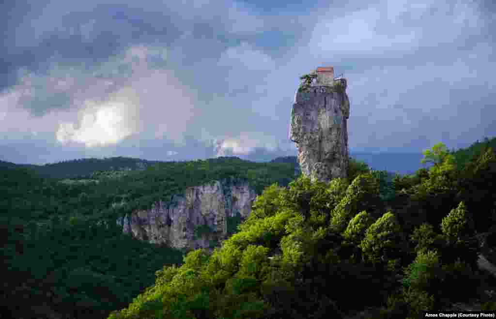The pillar at the end of a stormy day in the valley. For centuries the 40-meter high pillar was abandoned. In 1944 a group led by the mountaineer Alexander Japaridze made the first documented ascent of the pillar and discovered the remains of a chapel and the skeleton of a stylite.