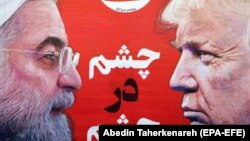 A copy Iranian daily newspaper 'Sazandegi' with pictures of Iranian president Hassan Rohani and U.S. President Donald Trump on its front page and a title reading in Persian 'Staring Down', April 9, 2019