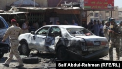После взрыва заминированного автомобиля в городе Кут. 29 июля 2013 г. 