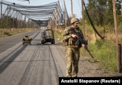 Ukrainian troops patrol a road near Kramatorsk, Donetsk region, on September 11.