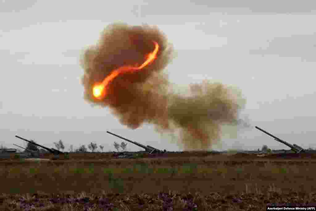 An image grab taken from a video made available on the official website of the Azerbaijani Defense Ministry on September 28 reportedly shows an Azerbaijani artillery strike toward the positions of Armenian separatists in the breakaway region of Nagorno-Karabakh.