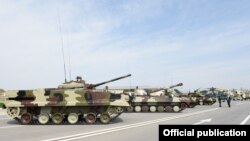 Azerbaijan - Russian-made tanks, artillery systems and attack helicopters put on display at a military base in Nakhichevan, 7Apr2014.