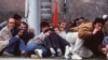 Residents of Sarajevo duck sniper fire during the spring of 1992