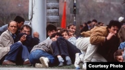 Residents of Sarajevo duck sniper fire during the spring of 1992