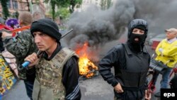 «Maydan»ın yığışdırılmasına şinləri yandırmaqla etiraz etdilər - 31 may 2014