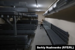 A girl explores a nuclear shelter in Kyiv on September 26. The Cold War-era shelter was renovated and opened to the public late last year.