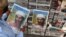 FILES-PAKISTAN-US-ATTACKS-BINLADEN-ANNIVERSARY / Where is Al-Qaeda today / In this file photograph taken on May 3, 2011, a Pakistani man reads a newspaper with the front page displaying news of the death of Osama bin Laden at a stall in Lahore.