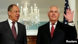U.S. Secretary of State Rex Tillerson (right) waves to the media next to Russian Foreign Minister Sergei Lavrov before their meeting at the State Department in Washington in May 2017.