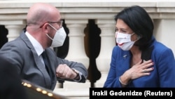 Georgian President Salome Zurabishvili (right) greets European Council President Charles Michel before a meeting in Tbilisi on April 20.