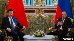 The new Chinese leader Xi Jinping chose Russia as his first foreign trip in March 2013, where he met President Vladimir Putin at the Kremlin.