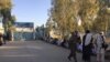 People wait in a long line to vote in parliamentary elections in Kandahar on October 27.
