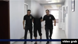 ბრალდებულის დაკავების კადრი