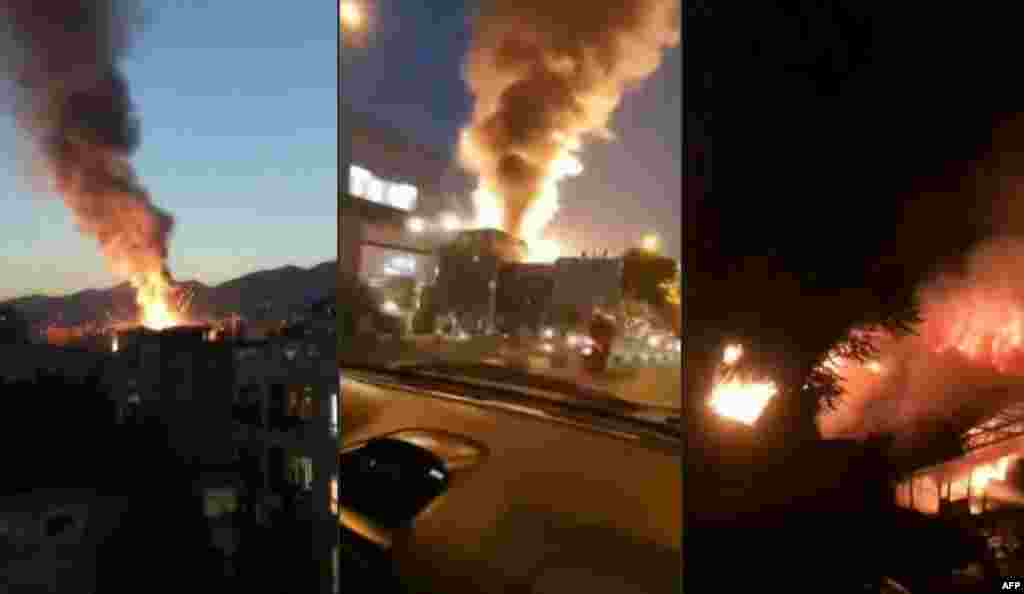 This combination image shows stills from footage obtained from the state-run Iran Press news agency of the fire and smoke following the powerful explosion.