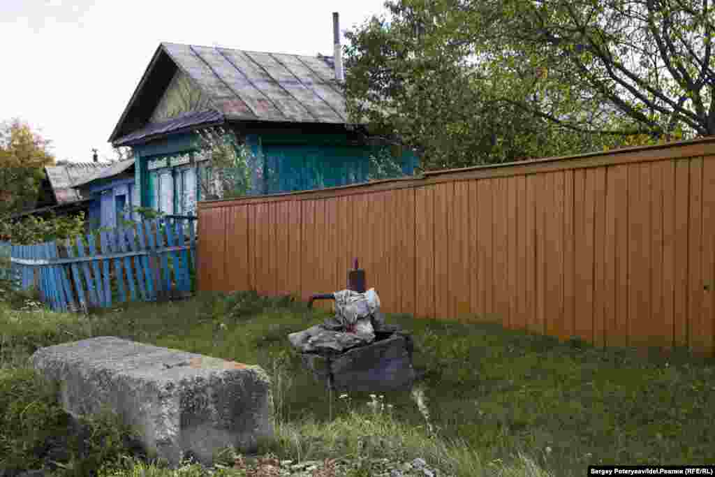 A water pump outside a house. "The authorities prohibited drinking water from local wells but couldn’t arrange supplies of clean water. A couple of months later, they took samples and said the local water was good enough to drink," says Ismagilova.
