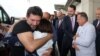 TURKEY -- Mehmet Hakan Atilla, an executive from state-controlled Halkbank, is welcomed by his relatives and Turkish Treasury and Finance Minister Berat Albayrak as he arrives at Istanbul International Airport in Istanbul, July 24, 2019