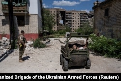 A wounded resident of the Ukrainian city of Druzhkivka is evacuated on a ground drone in July.