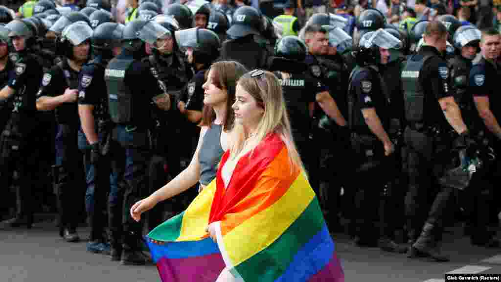 Ukrainian police guard participants of the Equality March organized by the LGBT community in Kyiv on June 23, 2019.