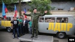 Liberal Democratic Party of Russia leader Vladimir Zhirinovsky, dressed as a Russian paratrooper, speaks in Moscow before sending humanitarian aid from his party to pro-Russian separatists in Luhansk and Donetsk in eastern Ukraine in June.