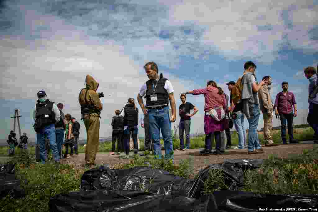 OSCE monitors visit the crash site.