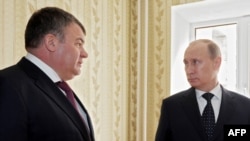 Then-Defense Minister Anatoly Serdyukov (left) with Prime Minister Vladimir Putin in the city of Engels in April, seven months before Serdyukov was sacked.