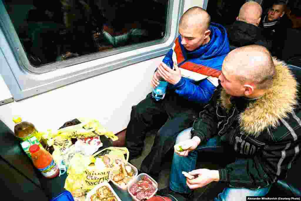 The recruits eat food from home as they approach the base, knowing that their officers are likely to grab it for themselves.