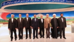 Presidential candidates pose for a group photo after their first live debate on state TV, in Tehran on May 31.