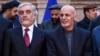 FILE: Abdullah Abdullah and Afghan President Ashraf Ghani (R) during an event in Kabul on February 29.