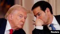 US President Donald Trump (left) listens to Secretary of State Marco Rubio during a round table at the White House on March 6.