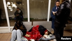 People take shelter during a Russian missile and drone attack on Kyiv on November 13. 