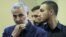 Jihad (Mustafa) Mughniyeh (R), the son of top Hezbollah commander Imad Mughniyeh standing next to Qasem Soleimani, the commander  of Quds force in Tehran, undated.