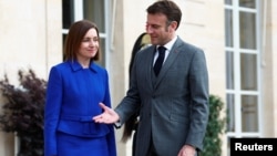 French President Emmanuel Macron receives Moldova's President Maia Sandu before a meeting at the Elysee Palace in Paris on March 7.