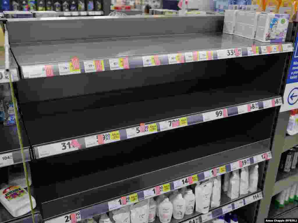 Shelves that stocked hand sanitizers and antibacterial soap stand empty inside a Tesco supermarket on Narodni Trida. The supermarket was otherwise well-stocked, though meat shelves were showing some shortages.&nbsp;