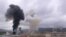 Smoke billows above buildings in Nagorno-Karabakh in Stepanakert amid ongoing fighting in the breakaway Azerbaijani region. 